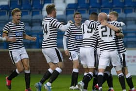 Queen’s Park’s players celebrate Ross MacLean’s goal (Photo: Ian Cairns).