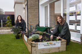 Laura Molloy, Founder of Goody Foody Gardens, and Lisa Curtis, Sales Advisor at CALA Homes (West) at one of the newly installed showhome garden veg patches.