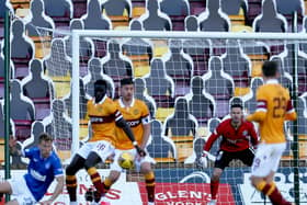 Bobby Madden awarded Ragers' first penalty for this handball by Motherwell defender Bevis Mugabi (Pic by Ian McFadyen)