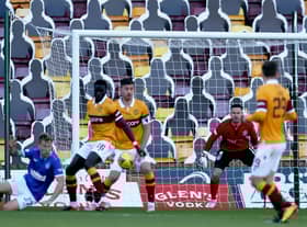 Bobby Madden awarded Ragers' first penalty for this handball by Motherwell defender Bevis Mugabi (Pic by Ian McFadyen)