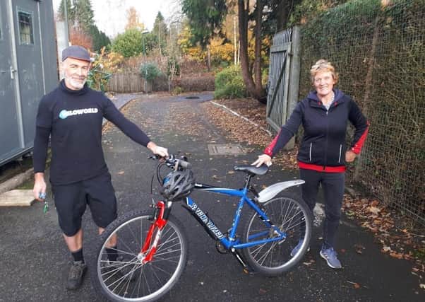 Gerardo Ballesteros from Veloworld presents Beat the Street prize winner Alison Harvey with her reconditioned bike