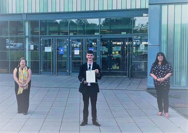 East Renfrewshire MP Kirsten Oswald (left) was joined by Clarkston, Netherlee and Williamwood councillor Annette Ireland as they met Michael Sinclair at the Williamwood High to present him with a copy of the parliamentary motion.