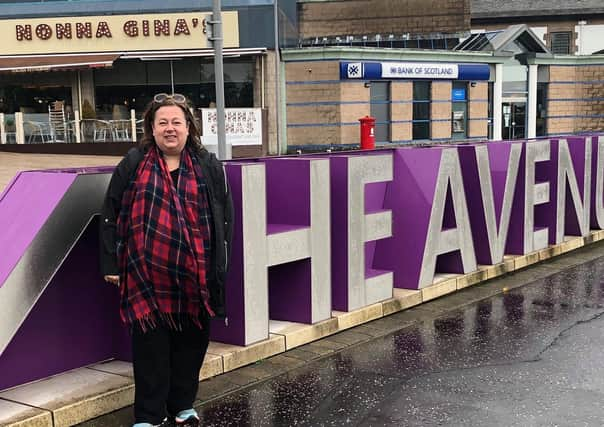 Kirsten passing Nonna Gina’s restaurant, Ayr Road, Newton Mearns