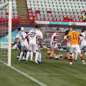 Jake Carroll (grounded) in the Accies penalty area as Motherwell fail to take a scoring chance in Saturday’s 3-0 derby defeat (Pic by Ian McFadyen)