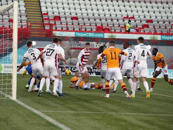 Jake Carroll (grounded) in the Accies penalty area as Motherwell fail to take a scoring chance in Saturday’s 3-0 derby defeat (Pic by Ian McFadyen)