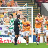 Motherwell's Declan Gallagher celebrates with team-mates after scoring his side's only goal against Celtic at Fir Park. (Photo by Mark Runnacles/Getty Images)