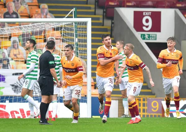 Motherwell's Declan Gallagher celebrates with team-mates after scoring his side's only goal against Celtic at Fir Park. (Photo by Mark Runnacles/Getty Images)