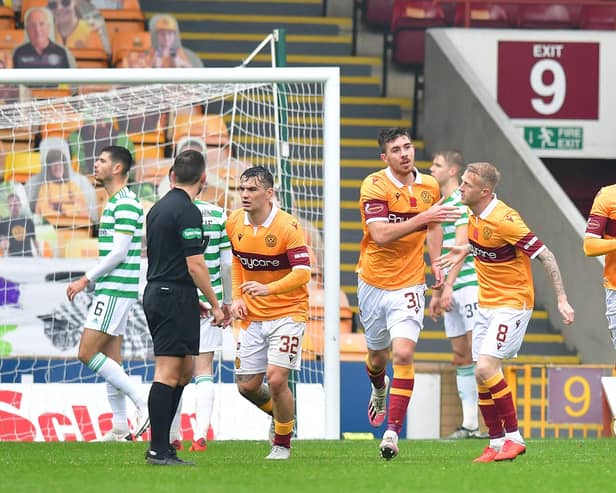 Motherwell's Declan Gallagher celebrates with team-mates after scoring his side's only goal against Celtic at Fir Park. (Photo by Mark Runnacles/Getty Images)