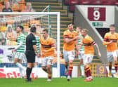 Motherwell's Declan Gallagher celebrates with team-mates after scoring his side's only goal against Celtic at Fir Park. (Photo by Mark Runnacles/Getty Images)