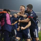 Declan Gallagher (1st right) celebrates with fellow Scotland heroes after historic penalty shootout win in Serbia (Pic courtesy of Getty Images)