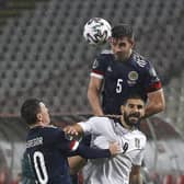 Motherwell and Scotland ace Declan Gallagher towers above Serbia's Aleksandar Mitrovic (Pic courtesy of Getty Images)