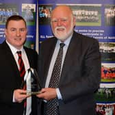 Jamie McKenzie is pictured after receiving his Clydesdale Sports Council 'Coach of the Year' prize from Councillor Hamish Stewart at the 2016 Sports Personality Awards (Pic by John Prior)
