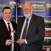 Jamie McKenzie is pictured after receiving his Clydesdale Sports Council 'Coach of the Year' prize from Councillor Hamish Stewart at the 2016 Sports Personality Awards (Pic by John Prior)