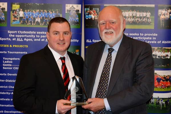 Jamie McKenzie is pictured after receiving his Clydesdale Sports Council 'Coach of the Year' prize from Councillor Hamish Stewart at the 2016 Sports Personality Awards (Pic by John Prior)