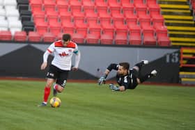 David Goodwillie evades Montrose keeper Aaron Lennox to score his first goal (pic: Craig Black Photography)