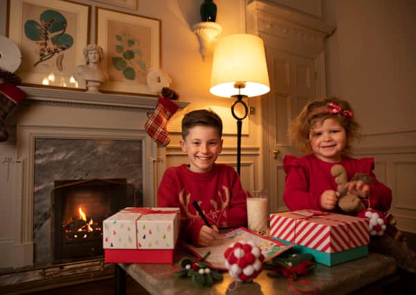 Jessica Roer and Seb Kwiecinska Randall help launch VisitScotland’s new festive Love Local campaign. Photo: VisitScotland
