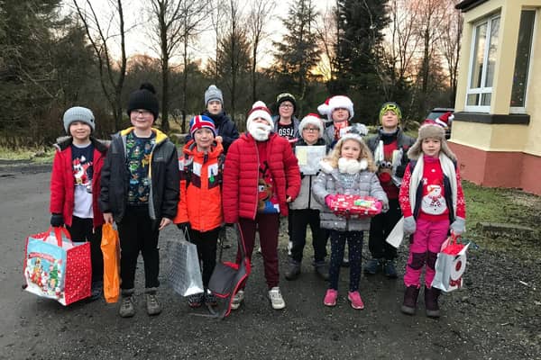 Clarkston Cubs and Beavers with their donations for The Jeely Piece Club.