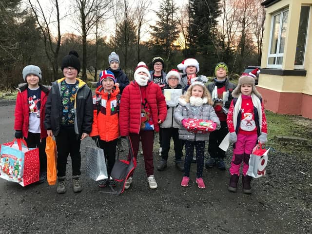 Clarkston Cubs and Beavers with their donations for The Jeely Piece Club.