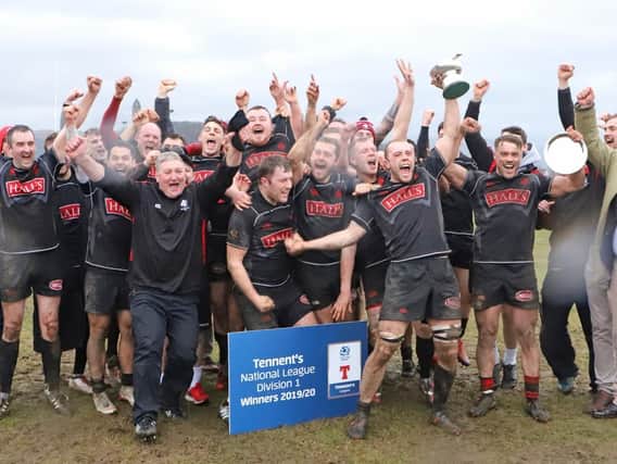 Biggar celebrating their 2019-20 title win, though it was subsequently rescinded after they lost an appeal to the SRU