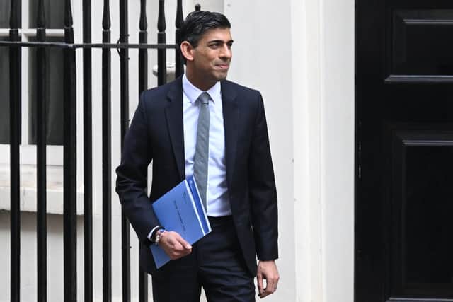 Chancellor of the Exchequer Rishi Sunak leaves 11 Downing Street for the House of Commons to deliver his Spring Statement on March 23.  (Photo by Leon Neal/Getty Images)