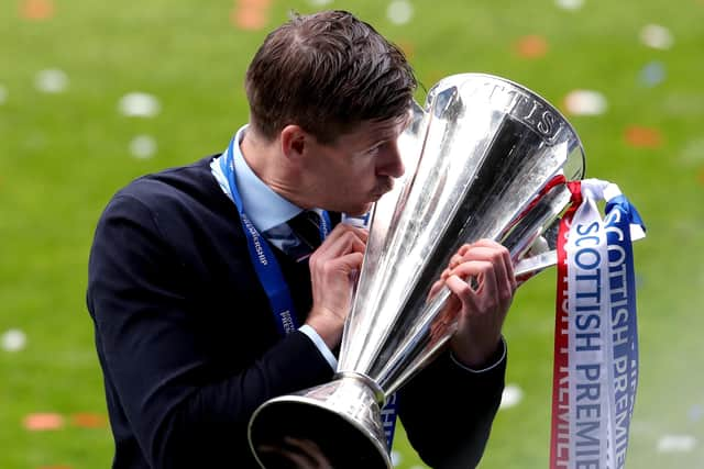 Rangers manager Steven Gerrard kisses the trophy as he celebrates winning the Scottish Premiership at Ibrox Stadium, Glasgow in May.