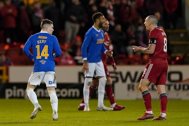 Rangers’ Ryan Kent (left) looks back at Aberdeen’s Scott Brown (right) after being sent off