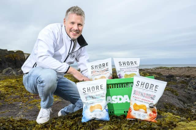 Keith Paterson, Founder of SHORE with the range of Seaweed Chips available in Asda