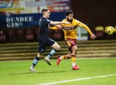 Jordan Roberts battles for possession