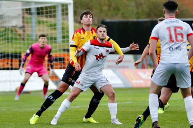 Ally Love holds off Partick Thistle's Ciaran McKenna during Clyde's defeat at Firhill (pic: Craig Black Photography)