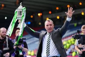 Northern Ireland-born Celtic manager Brendan Rodgers celebrates with the trophy after winning in the Scottish Gas Scottish Cup final at Hampden Park. (Photo by Jane Barlow/PA Wire)
