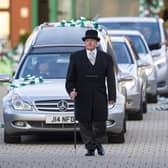 Celtic fans pay respect as Former Celtic player Bertie Auld's funeral cortege passes Celtic Park. Picture: Ross MacDonald/SNS Group
