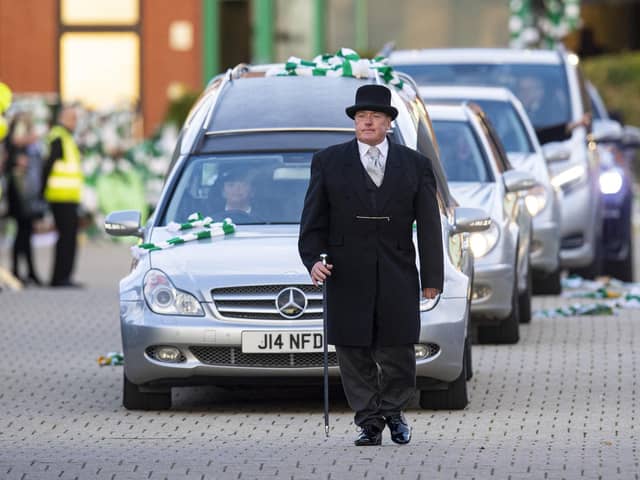 Celtic fans pay respect as Former Celtic player Bertie Auld's funeral cortege passes Celtic Park. Picture: Ross MacDonald/SNS Group