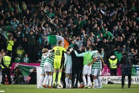 Celtic players celebrate in front of their fans after clinching the Scottish Premiership title with a 1-1 draw against Dundee United at Tannadice. (Photo by Alan Harvey / SNS Group)