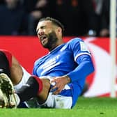 Rangers' Connor Goldson goes down in agony during the Liverpool match.