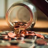 Coins falling out of jar