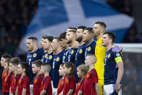 Scotland players line up during the national anthem prior to the win over Spain at Hampden in March. (Photo by Ross MacDonald / SNS Group)