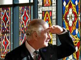 King Charles III views stain glass windows during a visit to the Burrell Collection