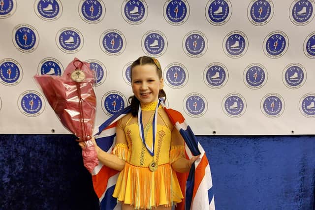 Victoria proudly displaying her medal