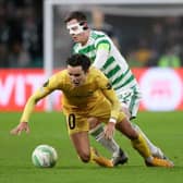 Callum McGregor tussles with Bodo/Glimt midfielder Hugo Vetlesen during the first leg of the Europa Conference League knockout round play-off tie at Celtic Park. (Photo by Craig Williamson / SNS Group)