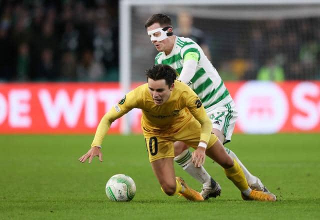 Callum McGregor tussles with Bodo/Glimt midfielder Hugo Vetlesen during the first leg of the Europa Conference League knockout round play-off tie at Celtic Park. (Photo by Craig Williamson / SNS Group)