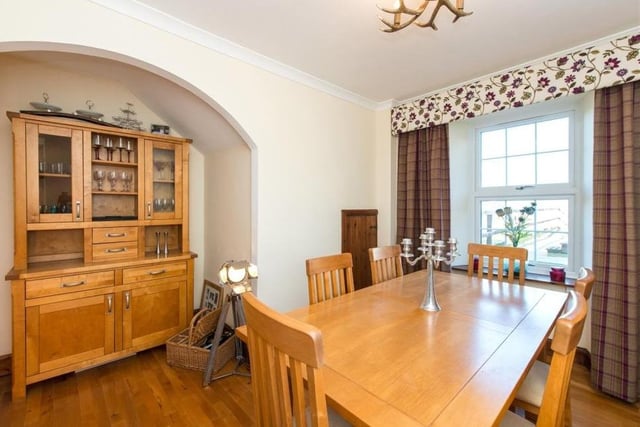 Dining room has ample space for the whole family to congregate as well as entertaining guests.