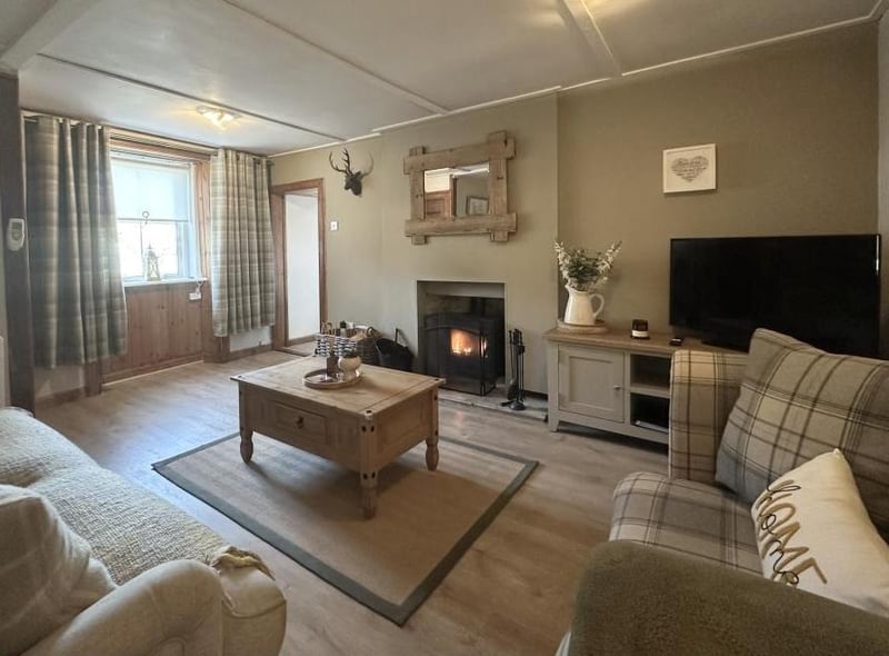 Another view of the lounge which is bathed in natural light and enjoys a feature fireplace to keep you warm. no matter the weather.