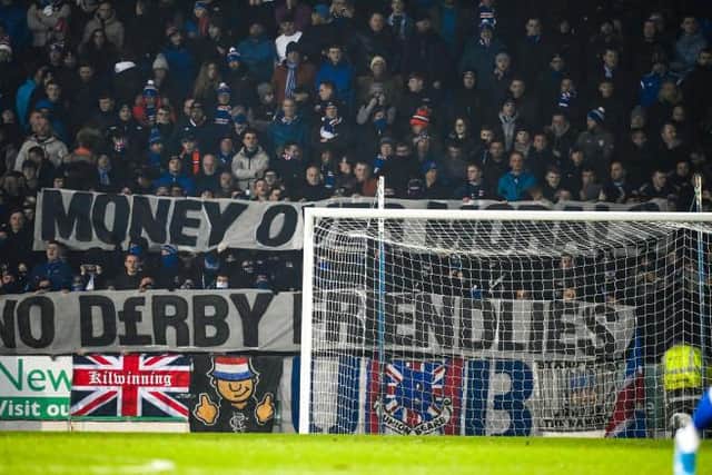 PERTH, SCOTLAND - MARCH 02: Rangers fans show a banner against the friendly in Australia during a Cinch Premiership match between St Johnstone and Rangers at McDiarmid Park, on March 02, in Perth, Scotland.  (Photo by Rob Casey / SNS Group)