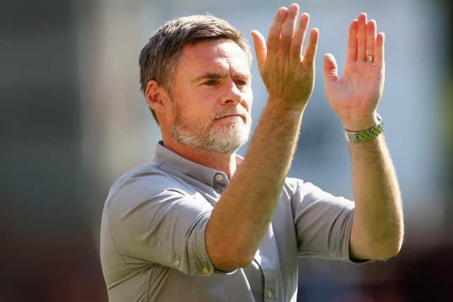 Motherwell manager Graham Alexander applauding at the end of the game