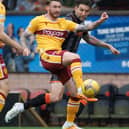 Callum Slattery and Charlie Mulgrew in action