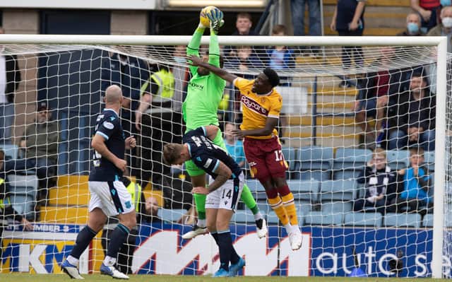 Justin Amaluzor tries to put pressure on Dundee rearguard