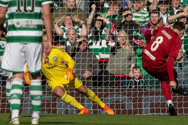 Steven Gerrard scores from the spot for Liverpool against Celtic in a charity match at Anfield.