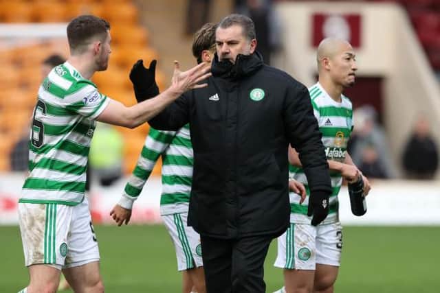 Celtic's Anthony Ralston (L) and manager Ange Postecoglou have worked on the defender's progress and development this season. (Photo by Craig Williamson / SNS Group)