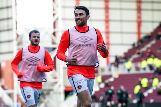 Hearts John Souttar warms up ahead of the match against Motherwell. (Photo by Ross Parker / SNS Group)