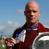 Petershill skipper and goal hero Ross McCabe celebrates his side's WoSFL Conference C title win (pic: @roguemonkeydm / WoSFL)